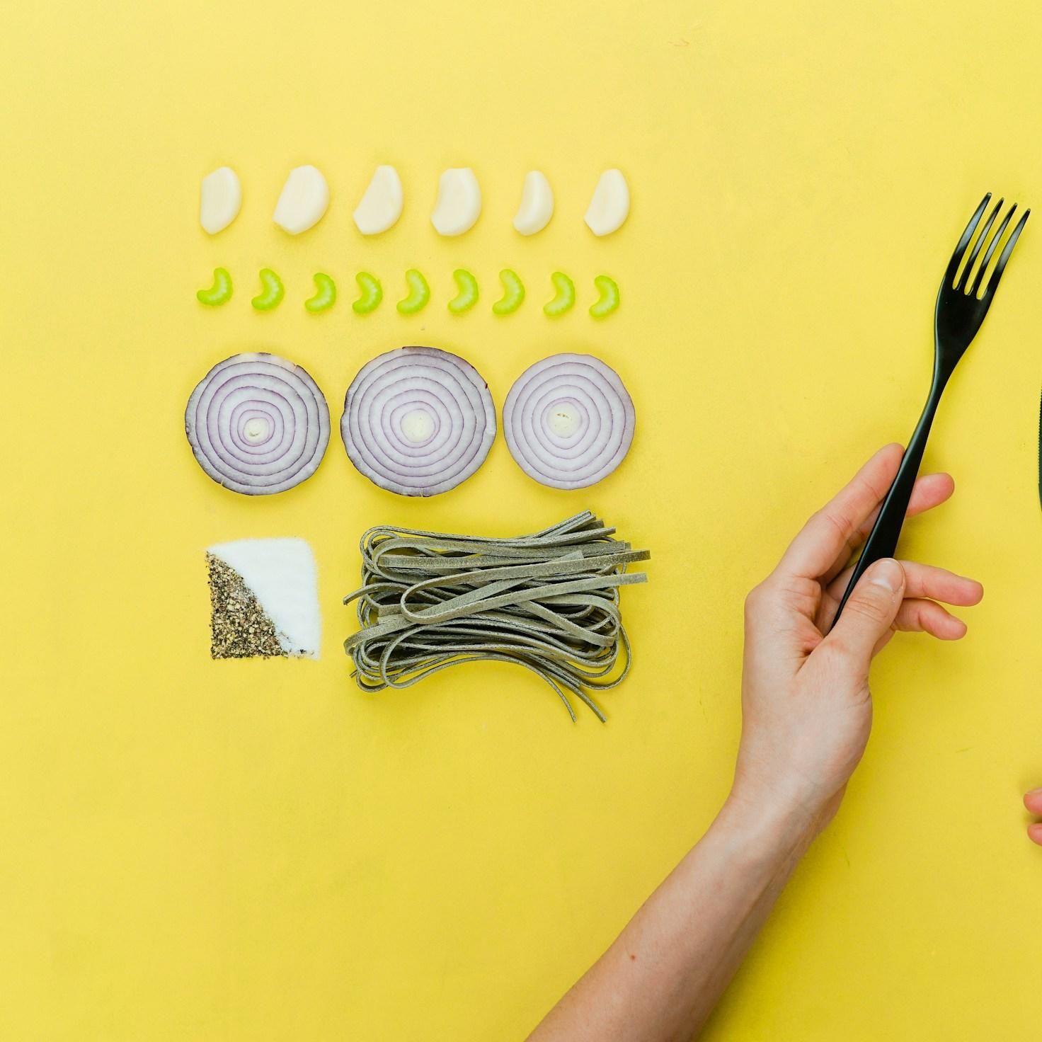 Community members collaborating in a modern kitchen space, sharing recipes and cooking techniques